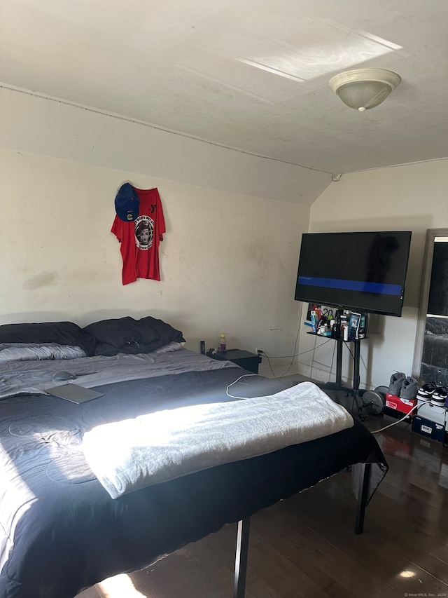 bedroom with wood-type flooring