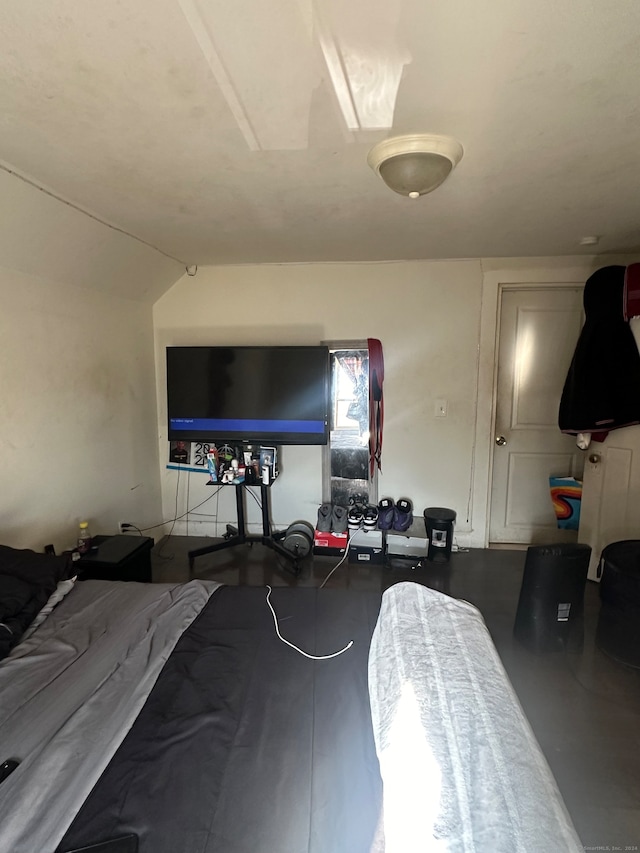 bedroom featuring concrete floors