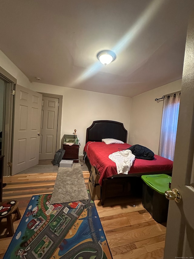 bedroom with wood-type flooring