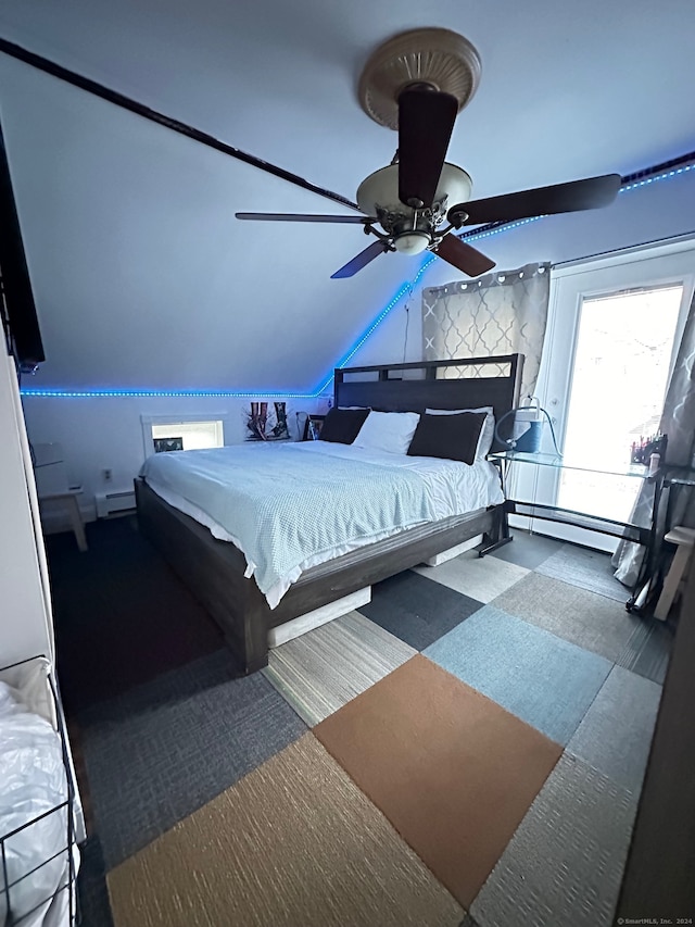 carpeted bedroom with ceiling fan and baseboard heating