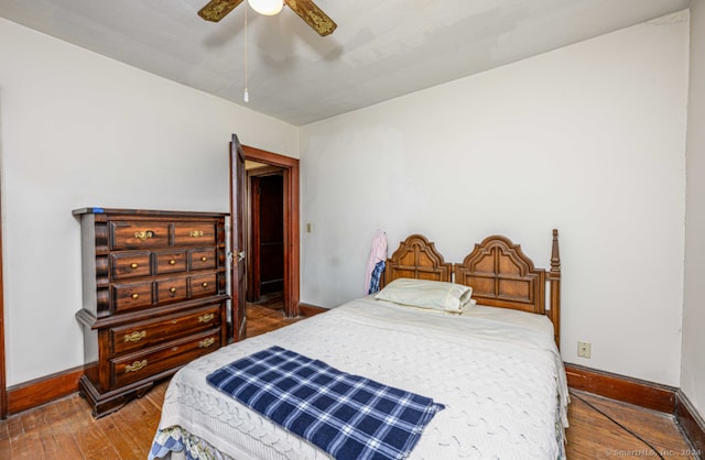 bedroom featuring ceiling fan and wood-type flooring