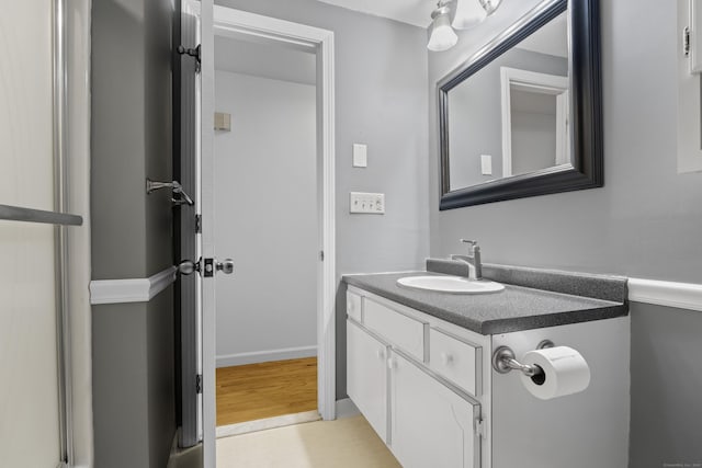 bathroom with hardwood / wood-style flooring and vanity