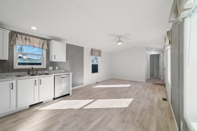 kitchen featuring light hardwood / wood-style floors, stainless steel dishwasher, a healthy amount of sunlight, and sink