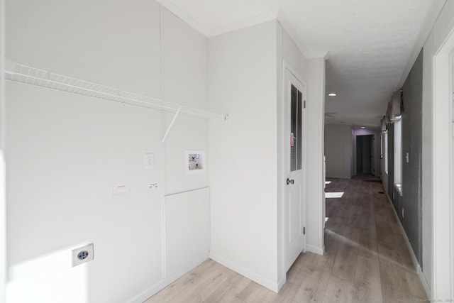 laundry area with electric dryer hookup, washer hookup, and light wood-type flooring