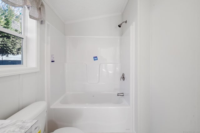 bathroom featuring lofted ceiling, toilet, ornamental molding, a textured ceiling, and shower / bath combination