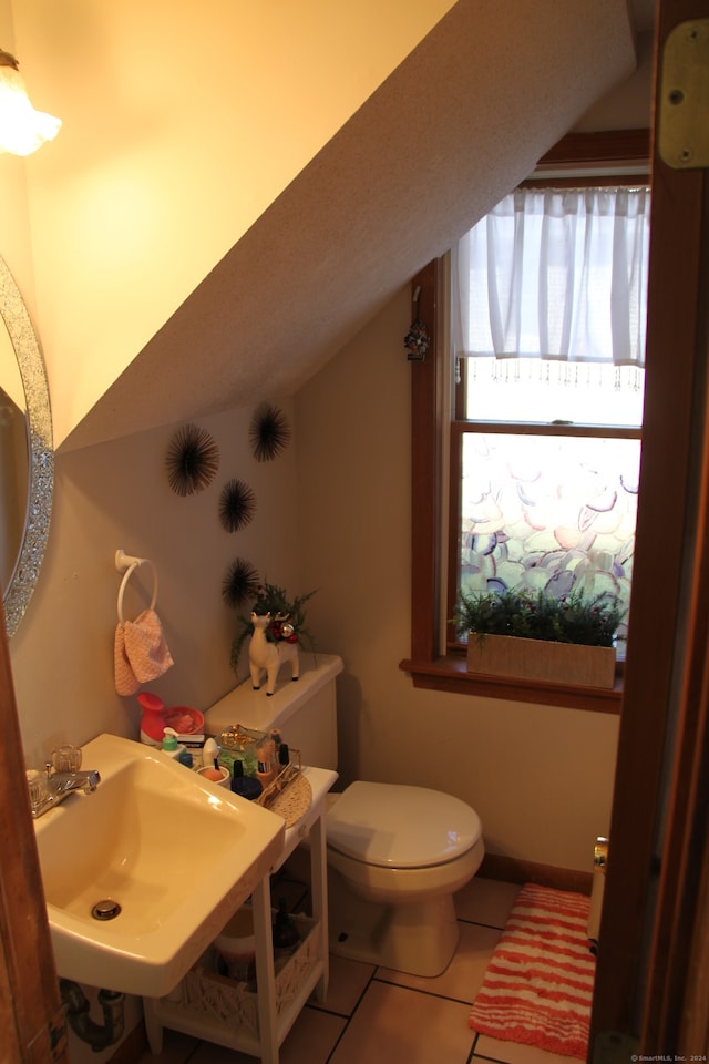 bathroom with tile patterned floors, sink, and toilet