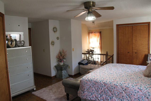 bedroom featuring ceiling fan and a closet