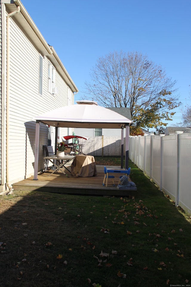 view of yard with a gazebo and a wooden deck