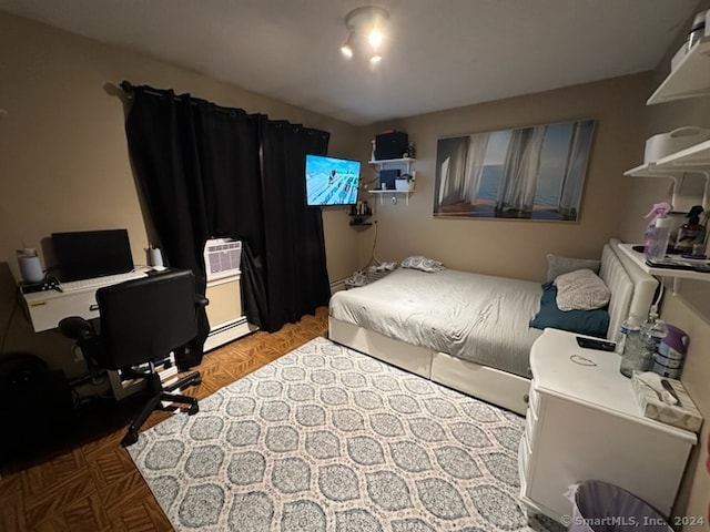 bedroom featuring light parquet flooring and a baseboard radiator