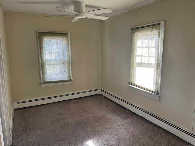 carpeted empty room with baseboard heating, plenty of natural light, and ceiling fan