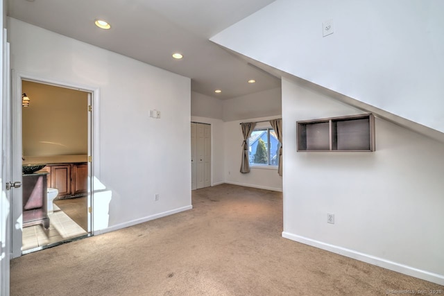 unfurnished room with light carpet