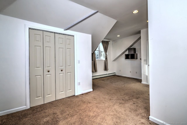 additional living space with a baseboard radiator and carpet flooring