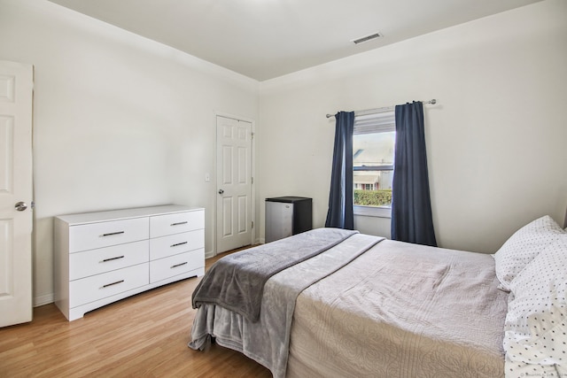 bedroom with light hardwood / wood-style flooring