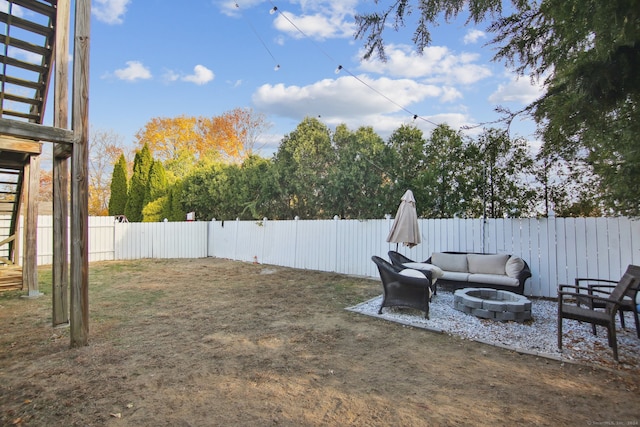 view of yard featuring a fire pit