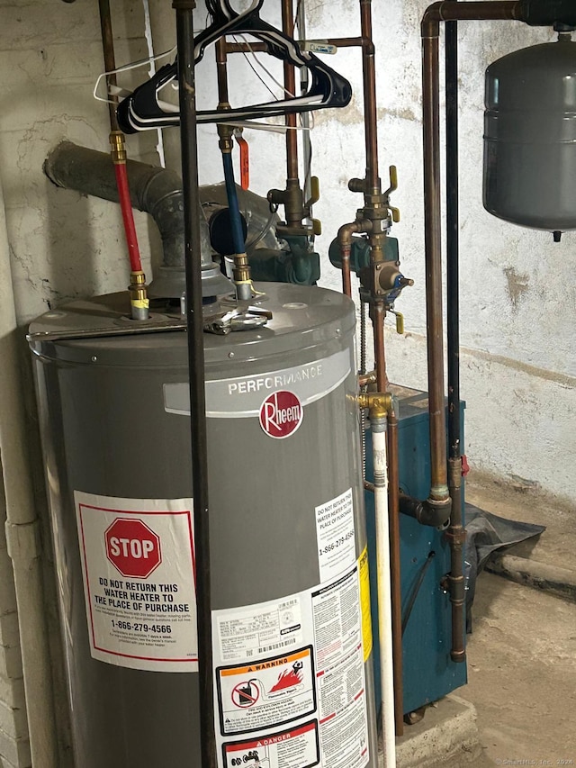 utility room featuring water heater