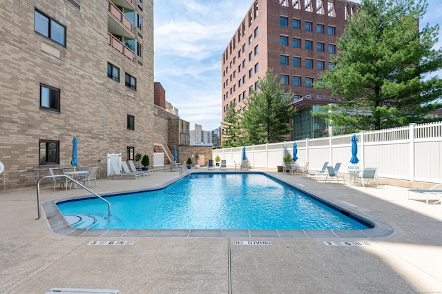 view of swimming pool featuring a patio