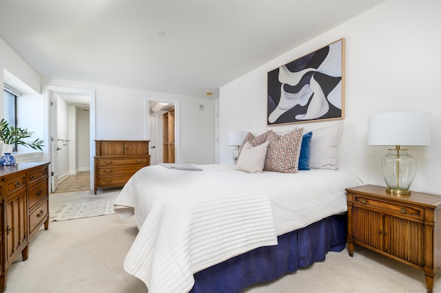 bedroom with light colored carpet