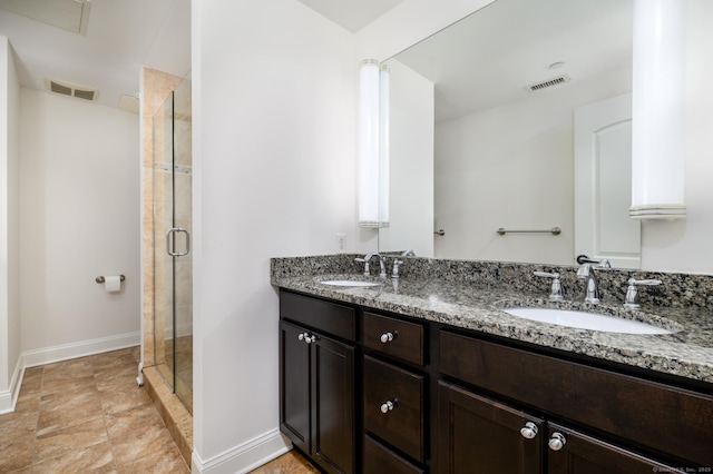 bathroom with vanity and an enclosed shower