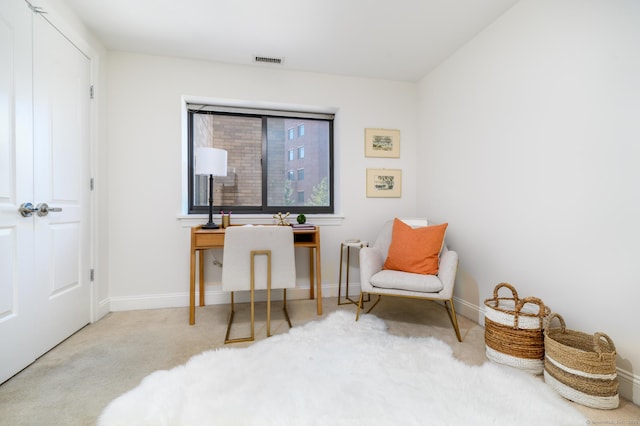 sitting room with light carpet