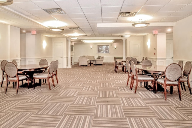 dining area with a drop ceiling