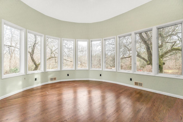 unfurnished sunroom with a healthy amount of sunlight