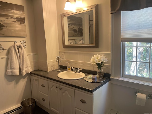 bathroom featuring vanity and a baseboard heating unit