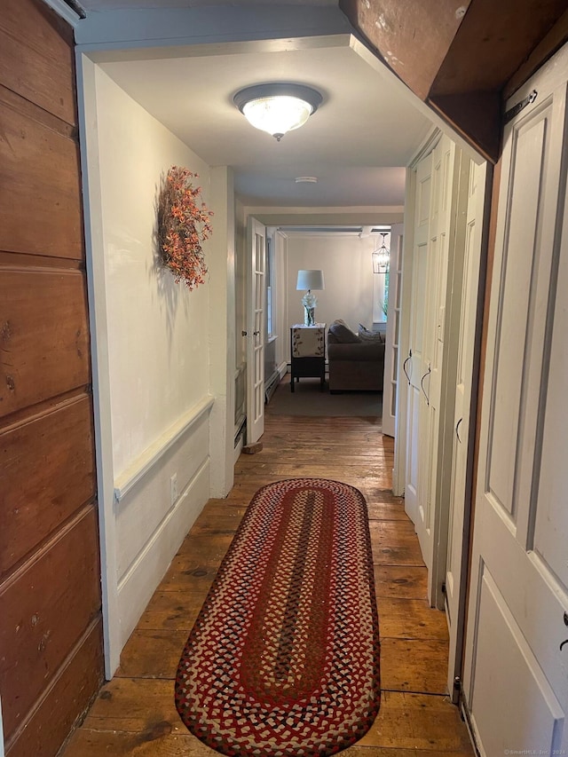 hall with hardwood / wood-style flooring