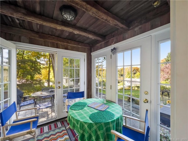 sunroom / solarium with beam ceiling, french doors, and wood ceiling