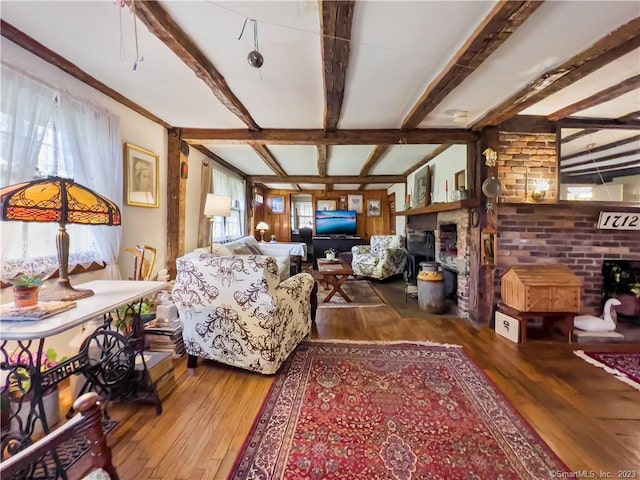 living room featuring beam ceiling and wood-type flooring