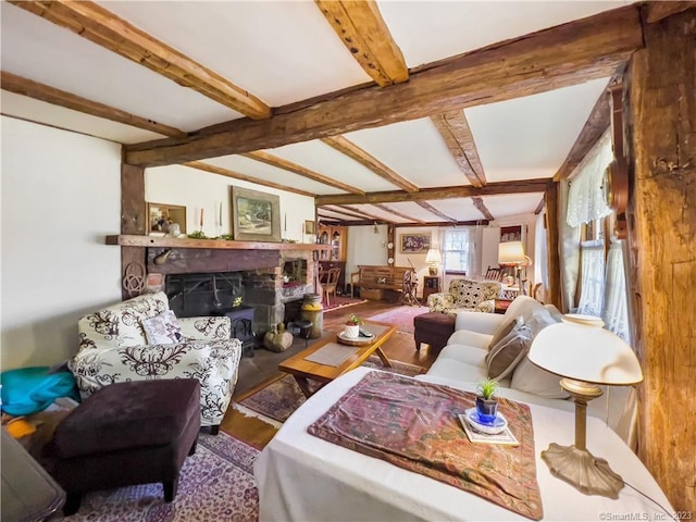 living room featuring hardwood / wood-style floors and beam ceiling