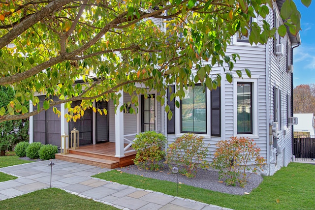 obstructed view of property with a front lawn