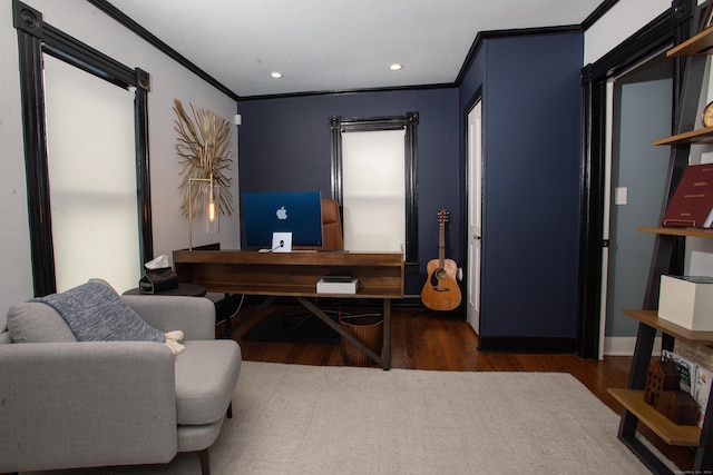 office area with dark hardwood / wood-style floors and ornamental molding