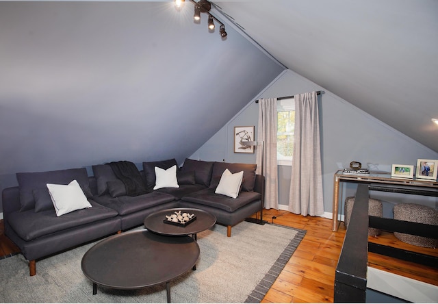 living room featuring hardwood / wood-style floors and lofted ceiling