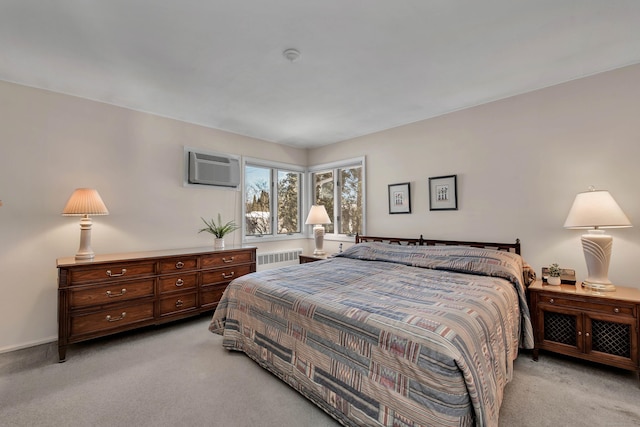 bedroom featuring light carpet, radiator heating unit, and a wall mounted air conditioner