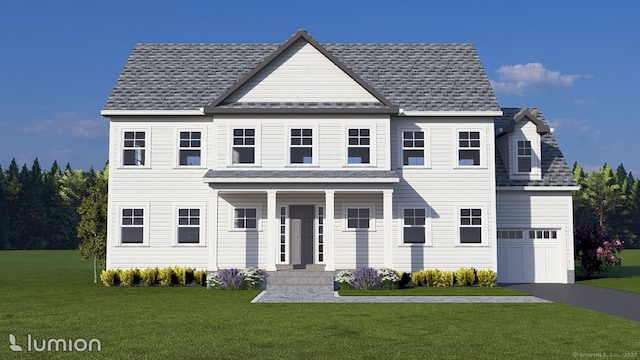 view of front of property with a garage and a front yard