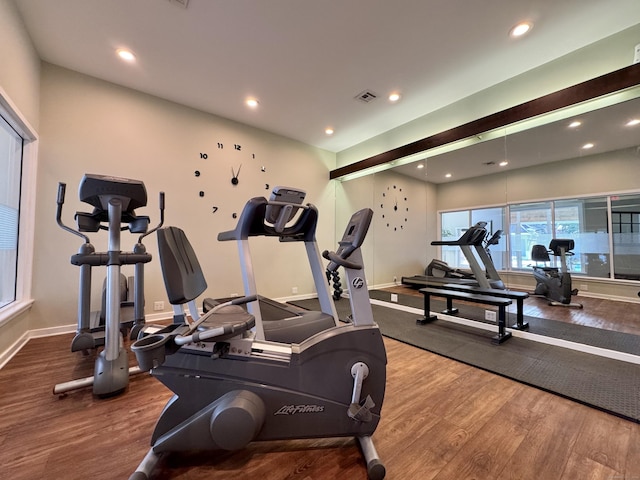 workout area with hardwood / wood-style flooring