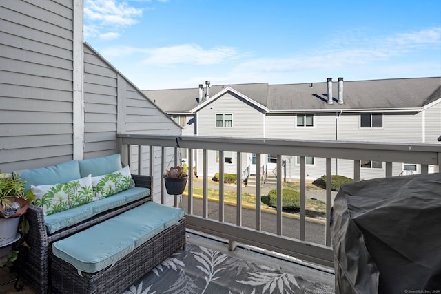 balcony with an outdoor hangout area and grilling area