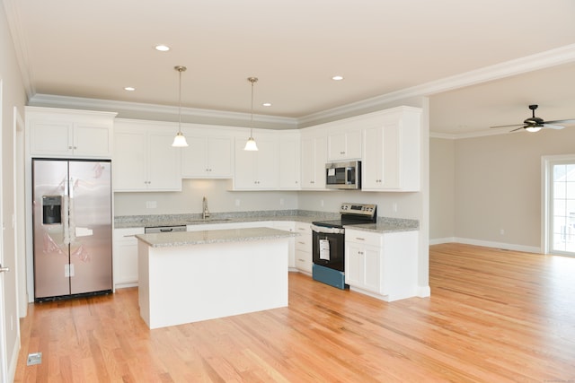 kitchen featuring light hardwood / wood-style floors, white cabinetry, and appliances with stainless steel finishes