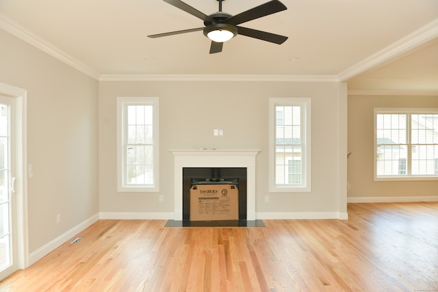 unfurnished living room featuring ceiling fan, light hardwood / wood-style floors, and ornamental molding