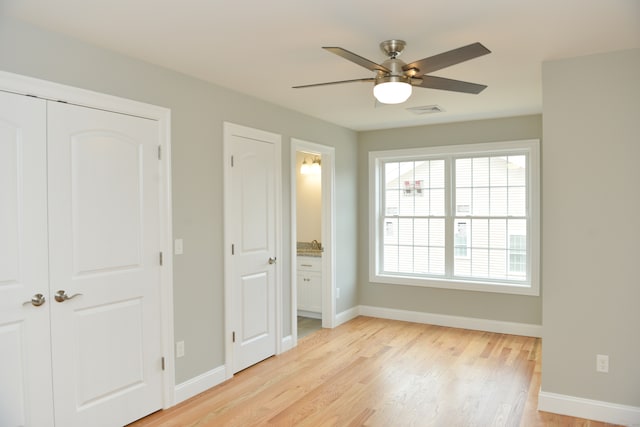 unfurnished bedroom featuring ceiling fan and light hardwood / wood-style flooring