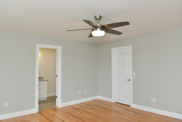 spare room featuring ceiling fan and light wood-type flooring