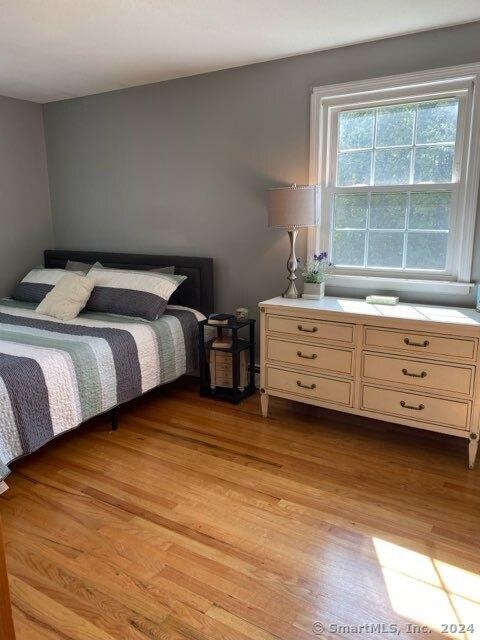 bedroom with light hardwood / wood-style floors