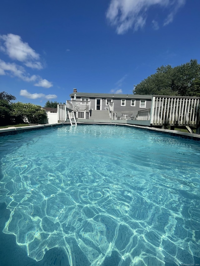 view of swimming pool featuring a deck