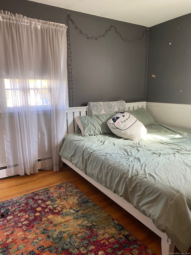 bedroom featuring wood-type flooring