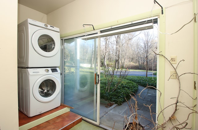 laundry room featuring stacked washer and clothes dryer