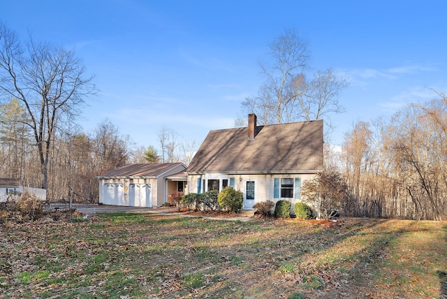 view of front facade with a garage and a front lawn