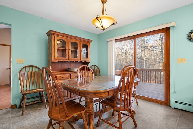 dining area with a baseboard heating unit