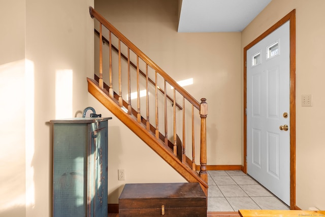 entryway featuring light tile patterned floors