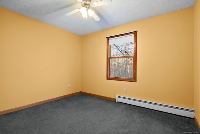 empty room featuring dark colored carpet, a textured ceiling, baseboard heating, and ceiling fan