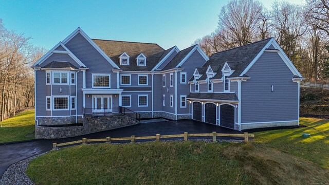 34 Fox Run Rd, Redding, CT 06896 - view of front facade featuring driveway, a front yard, a garage, and french doors